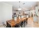 Open floor plan showcasing the dining area and modern kitchen with stainless steel appliances and granite countertops at 9963 Hartford Maroon Rd, Orlando, FL 32827