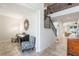 Open foyer with staircase and view into living spaces with tiled floor at 9963 Hartford Maroon Rd, Orlando, FL 32827