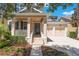 Charming home showcasing a welcoming entrance and well-manicured landscaping at 9963 Hartford Maroon Rd, Orlando, FL 32827