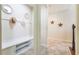 Hallway with tile floors, decorative mirrors, and built-in bench storage at 9963 Hartford Maroon Rd, Orlando, FL 32827
