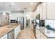 Bright kitchen featuring stainless steel appliances, granite countertops, and a walk-in pantry at 9963 Hartford Maroon Rd, Orlando, FL 32827