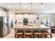 Spacious kitchen boasting a large island with seating and stainless steel appliances at 9963 Hartford Maroon Rd, Orlando, FL 32827