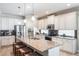 Stylish kitchen showcasing a large island with seating and ample cabinet space at 9963 Hartford Maroon Rd, Orlando, FL 32827