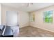 Bright, open room featuring tiled floors, a piano, and natural lighting at 9963 Hartford Maroon Rd, Orlando, FL 32827
