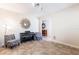 Cozy seating area featuring stylish chairs, a piano, and ample natural light at 9963 Hartford Maroon Rd, Orlando, FL 32827