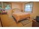 Cozy bedroom featuring a comfortable queen-size bed and inviting natural light at 1 Cosmos Dr, Orlando, FL 32807