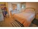 Comfortable bedroom with natural light, complemented by decor and closet space at 1 Cosmos Dr, Orlando, FL 32807