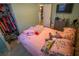 Inviting bedroom featuring closet space, tv, and a comfortable bed at 1 Cosmos Dr, Orlando, FL 32807