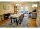 Comfortable dining area with hardwood floors, natural light, and a view to the outdoor area for enjoyable meals at 1 Cosmos Dr, Orlando, FL 32807