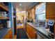 Spacious kitchen with wooden cabinets, stainless steel appliances, and a convenient layout for cooking and entertaining at 1 Cosmos Dr, Orlando, FL 32807