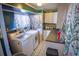 Efficient laundry room with appliances, practical countertops, and tiled floor at 1 Cosmos Dr, Orlando, FL 32807
