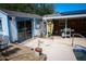 Backyard view of the poolside area and cottage, offering relaxation and functionality for outdoor enjoyment at 1 Cosmos Dr, Orlando, FL 32807