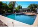 Refreshing swimming pool, surrounded by lush landscaping, creating a private oasis for relaxation and recreation at 1 Cosmos Dr, Orlando, FL 32807