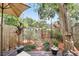 Secluded backyard space, featuring a wooden deck, a wooden fence, and tasteful garden decorations at 1005 Love Ln # 25, Apopka, FL 32703