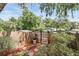 Beautiful backyard with green trees, a wooden fence, and fresh landscaping at 1005 Love Ln # 25, Apopka, FL 32703