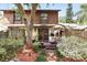 Cozy backyard with a small deck, lounge chair, an umbrella and fresh mulch at 1005 Love Ln # 25, Apopka, FL 32703