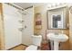 Bathroom features a white pedestal sink, a rain style shower head, and mosaic tile accents at 1005 Love Ln # 25, Apopka, FL 32703