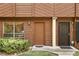 Close up of front doors on a two-story townhome showing nice landscaping around the doors at 1005 Love Ln # 25, Apopka, FL 32703