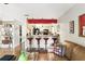 Kitchen and living room view with breakfast bar featuring barstool seating and pendant lighting at 1005 Love Ln # 25, Apopka, FL 32703
