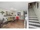 Inviting living room features hardwood floors and stairs leading to the upper level at 1005 Love Ln # 25, Apopka, FL 32703