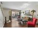 Comfortable living room featuring a picture window, beautiful lighting, and stylish decor at 1005 Love Ln # 25, Apopka, FL 32703