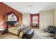 Bright main bedroom featuring a ceiling fan, seating area, and modern decor at 1005 Love Ln # 25, Apopka, FL 32703