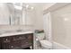 Bright bathroom with a double sink vanity, skylight, and a shower-tub combination at 1046 Blackwood St, Altamonte Springs, FL 32701