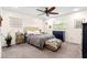 Cozy bedroom with modern ceiling fan, plush carpet, and lots of natural light at 1046 Blackwood St, Altamonte Springs, FL 32701