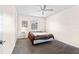 Simple bedroom featuring neutral walls, carpet, ceiling fan, and a comfortable bed at 1046 Blackwood St, Altamonte Springs, FL 32701