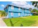 Spacious home with a vibrant blue exterior and lush green lawn, showcasing curb appeal at 1046 Blackwood St, Altamonte Springs, FL 32701