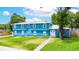 Charming blue two-story home featuring a metal roof, a well-kept lawn, and a welcoming entrance at 1046 Blackwood St, Altamonte Springs, FL 32701