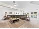 Large living room features recessed lighting, wood-look tile floors and view of pool through sliding glass doors at 1046 Blackwood St, Altamonte Springs, FL 32701