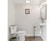 A well-lit powder room featuring modern fixtures, neutral walls, and a compact design at 1046 Blackwood St, Altamonte Springs, FL 32701