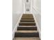 Carpeted staircase with white walls and trim at 1046 Blackwood St, Altamonte Springs, FL 32701