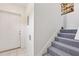Carpeted stairs lead from the door to an upper level, adding character to the home's entryway at 1046 Blackwood St, Altamonte Springs, FL 32701