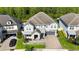 Stunning aerial view of home showcasing manicured lawn, brick driveway, and well-maintained landscaping at 10626 Bonne Chance Dr, Orlando, FL 32832