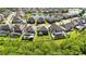 A high angle view of a suburban neighborhood featuring a community pond at 10626 Bonne Chance Dr, Orlando, FL 32832