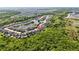 Beautiful aerial view of a residential community with ponds and lush green surroundings at 10626 Bonne Chance Dr, Orlando, FL 32832