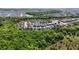 Aerial view of a lovely residential community with serene ponds and verdant trees at 10626 Bonne Chance Dr, Orlando, FL 32832
