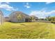 Spacious backyard with large lawn and fenced perimeter surrounding property at 10626 Bonne Chance Dr, Orlando, FL 32832