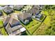 Aerial view of backyard with pool, screened enclosure, lush lawn, and privacy fencing at 10626 Bonne Chance Dr, Orlando, FL 32832