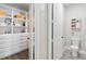 Stylish bathroom featuring a toilet, patterned tile floor, and built-in shelving and drawers at 10626 Bonne Chance Dr, Orlando, FL 32832