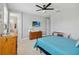 Comfortable bedroom with a ceiling fan, and light walls at 10626 Bonne Chance Dr, Orlando, FL 32832