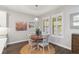 Cozy breakfast nook area filled with natural light and a view to the kitchen at 10626 Bonne Chance Dr, Orlando, FL 32832