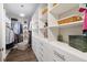 Spacious walk-in closet with custom shelving, drawers, and ample storage for clothes and accessories at 10626 Bonne Chance Dr, Orlando, FL 32832