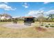 A quiet community park with seating at 10626 Bonne Chance Dr, Orlando, FL 32832