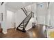 Grand foyer with a staircase, wood flooring, and plenty of natural light at 10626 Bonne Chance Dr, Orlando, FL 32832