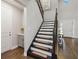 Welcoming foyer featuring a staircase and wood flooring at 10626 Bonne Chance Dr, Orlando, FL 32832