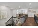Second-floor hallway with hardwood floors and a view of the downstairs foyer at 10626 Bonne Chance Dr, Orlando, FL 32832