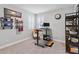 Functional office space with stand-up desk, ergonomic chair, ample natural light, and open shelving at 10626 Bonne Chance Dr, Orlando, FL 32832